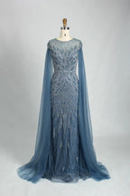 Blue beaded tulle cape mermaid evening dress with long sleeves and flowing skirt