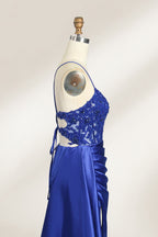 A mannequin showcases a royal - blue gown with thin straps. The bodice features intricate bead embroidery and sheer panels, while the skirt has a ruched design and a high side slit. The satin fabric and elegant details make it perfect for formal events like proms or galas, exuding sophistication.6