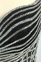 Set against a light background, a mannequin presents a black tulle gown with silver - toned beaded embellishments. Thin straps, a sweetheart neckline, and a mermaid - style skirt complete the look. The geometric bead patterns add a touch of glamour, ideal for proms or formal events where the beaded artistry stands out.6