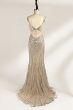 A mannequin numbered “6” displays a black tulle gown against a light backdrop. It features thin straps, a deep V - neckline, and a mermaid silhouette. The intricate silver bead patterns, sheer bodice with vertical accents, and high side slit add glamour, perfect for formal galas.2