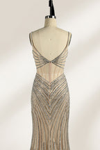 A mannequin numbered “6” displays a black tulle gown against a light backdrop. It features thin straps, a deep V - neckline, and a mermaid silhouette. The intricate silver bead patterns, sheer bodice with vertical accents, and high side slit add glamour, perfect for formal galas.3