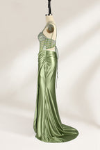 A mannequin presents a green satin gown with a bejeweled, sheer bodice against a light backdrop. It features thin straps, a sweetheart neckline, and a mermaid - shaped skirt. The sparkling embellishments and smooth fabric exude elegance, perfect for formal galas.4