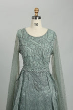 Teal beaded A-line dress with illusion long sleeves, embroidered texture, scoop neck
