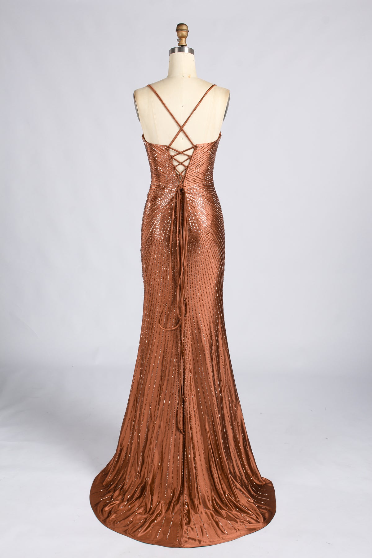 Terracotta beaded mermaid evening gown with crisscross back straps and a floor-length skirt