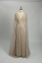 Sequin evening gown with cape sleeves, V-neck bodice, mermaid silhouette, champagne