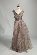 Blush pink sleeveless evening dress with V-neck beaded bodice and full skirt