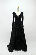 Black long-sleeve sequin evening dress with V-neck and flowing skirt