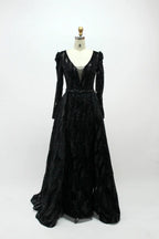 Black long-sleeve sequin evening dress with V-neck and flowing skirt