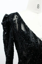 Black long-sleeve sequin fabric detail with V-neck and fitted bodice panel