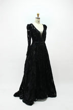 Black long-sleeve sequined evening dress with fitted waist and full skirt