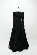 Black long-sleeve sequined evening dress with flared skirt and belted waist (back view)