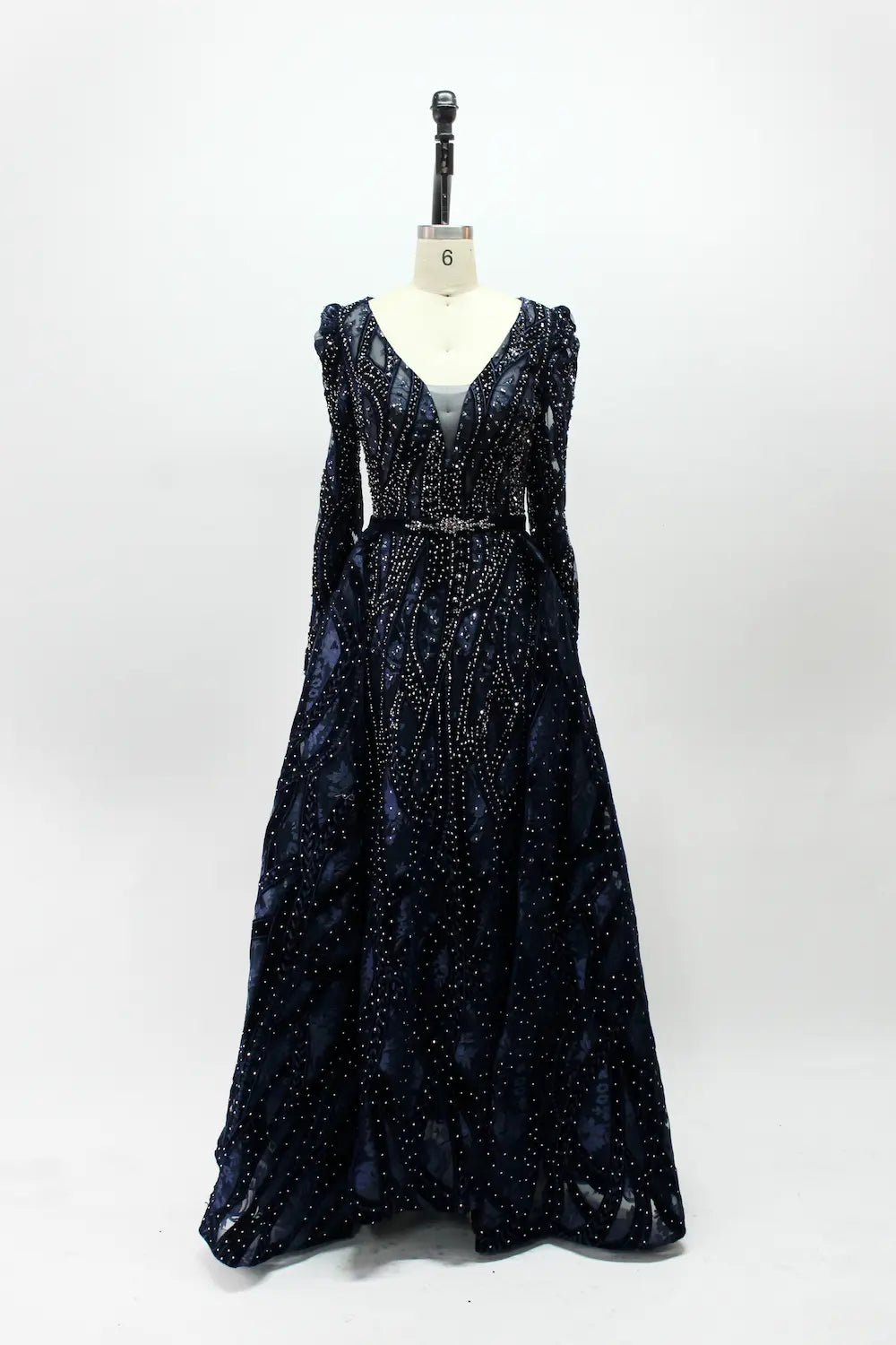 Navy blue long-sleeve sequin evening dress with V-neck and gathered skirt