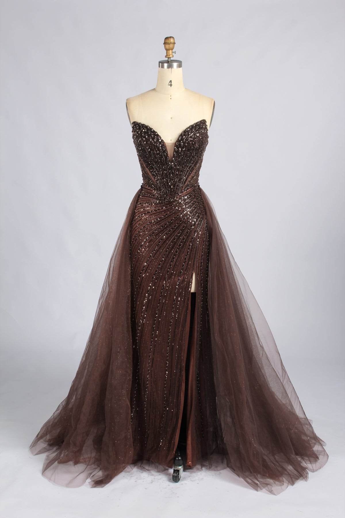 Brown strapless beaded prom dress with a sweetheart neckline, thigh slit, and full tulle skirt.