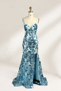 Set against a light background, a mannequin presents a light - blue tulle gown adorned with intricate floral sequin patterns. It has thin spaghetti straps, a sweetheart neckline, and a mermaid - shaped skirt with a high side slit. The shimmering sequins and delicate design create a glamorous look, ideal for proms or formal evening events.1