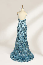 Set against a light background, a mannequin presents a light - blue tulle gown adorned with intricate floral sequin patterns. It has thin spaghetti straps, a sweetheart neckline, and a mermaid - shaped skirt with a high side slit. The shimmering sequins and delicate design create a glamorous look, ideal for proms or formal evening events.2