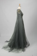 A-line beaded gown with sheer cape sleeves and V-back detail, dark metallic sparkle
