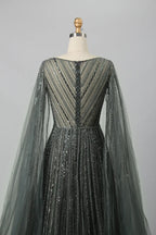 Back view of beaded A-line gown with V back and sheer cape sleeves, dark metallic beadwork