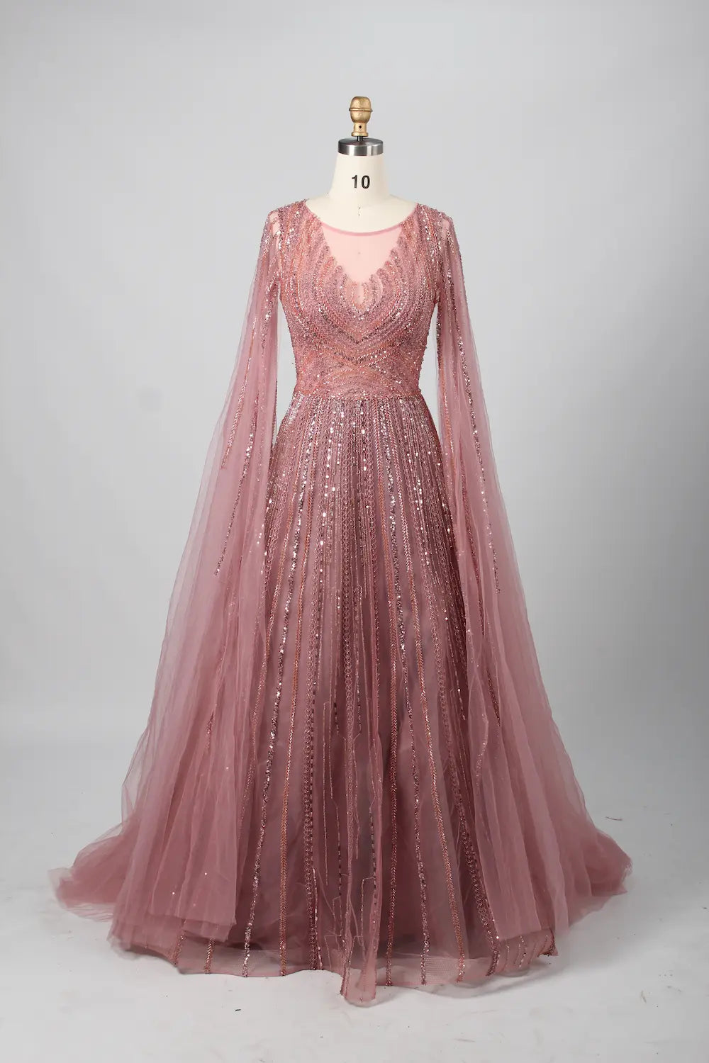 Beaded A-line gown with V neckline, sheer cape sleeves, and pink sparkling sequin beadwork