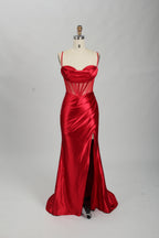 Red satin prom dress with sheer corset bodice, side slit & drape. Luxe, eye-catching design—perfect for bulk orders in premium formal collections.