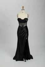 Black satin prom dress with sheer corset bodice, side slit & drape. Luxe, eye-catching design—perfect for bulk orders in premium formal collections.