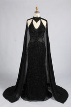 Black beaded halter mermaid gown with draped shoulder cape and V-neck detail