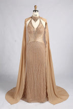 Champagne/gold beaded halter mermaid gown with sheer cape and V-neck detail