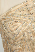 Champagne sequin and rhinestone embroidery on one-shoulder gown fabric