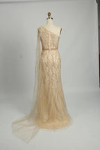 Champagne one-shoulder sequin sheath dress with waist belt and layered tulle train