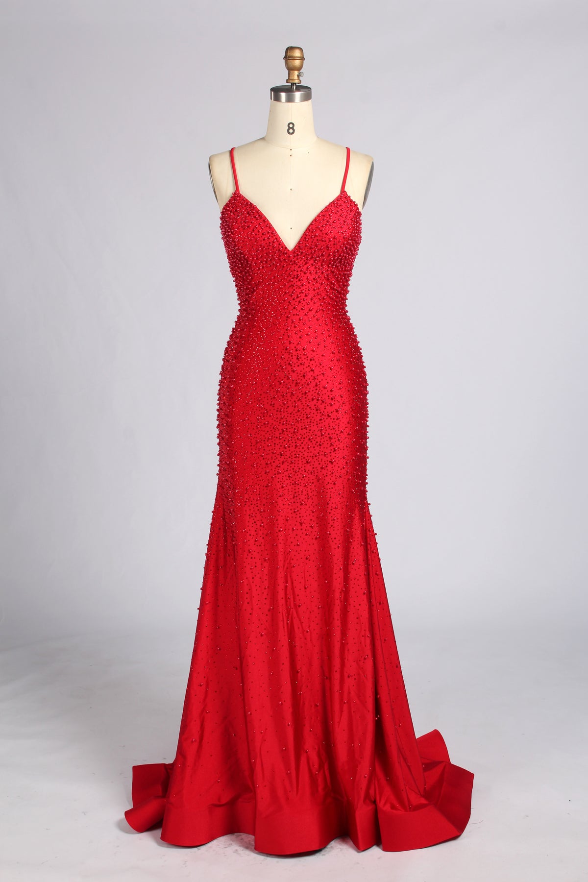 Red beaded mermaid prom dress with spaghetti straps and V-neck; fitted skirt