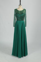 Emerald green mother-of-the-bride dress with long sleeves and sequin beaded bodice