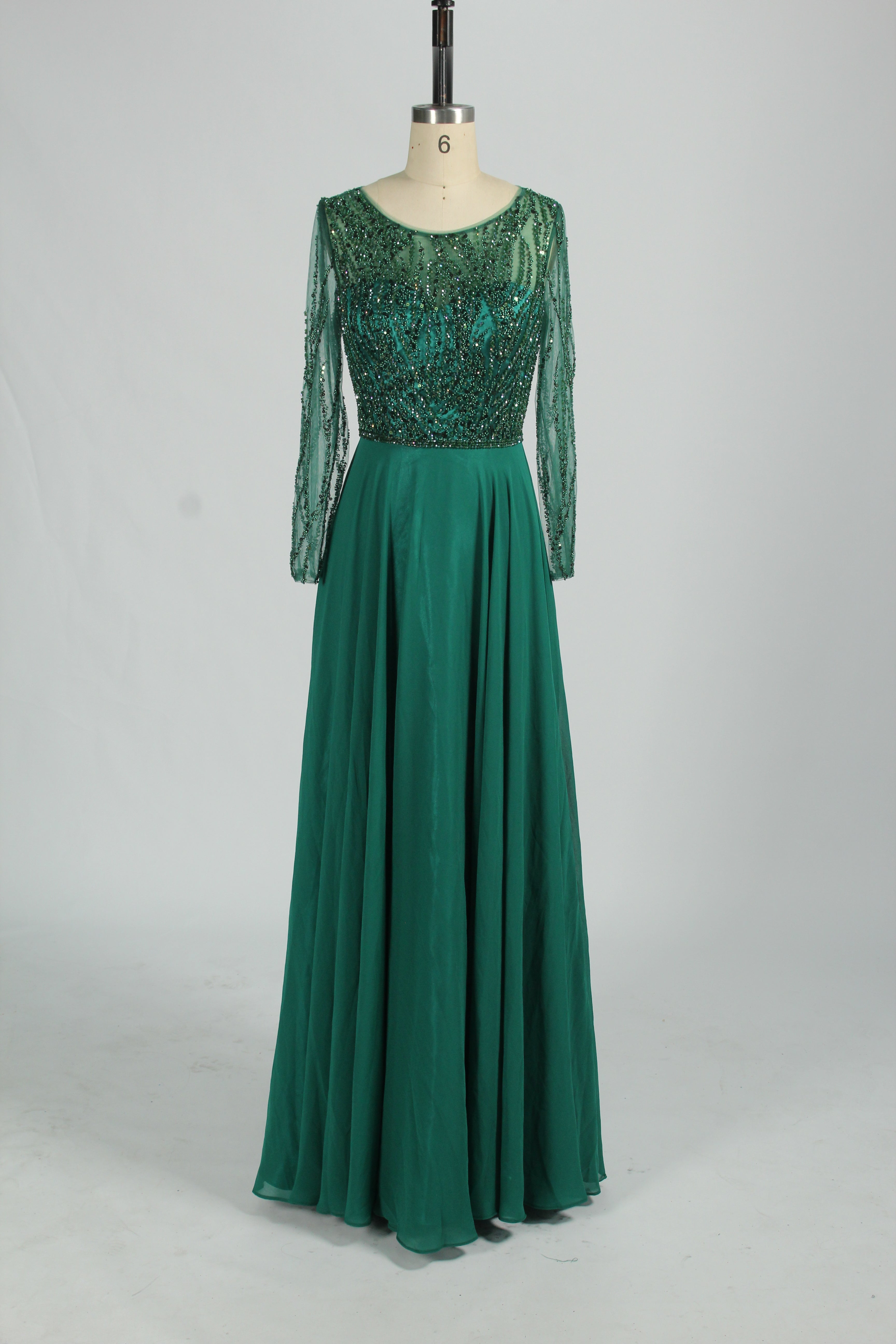 Emerald green mother-of-the-bride dress with long sleeves and sequin beaded bodice