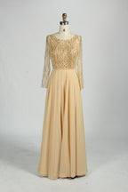 Champagne-gold mother-of-the-bride dress with long sheer sleeves and bead sequin bodice