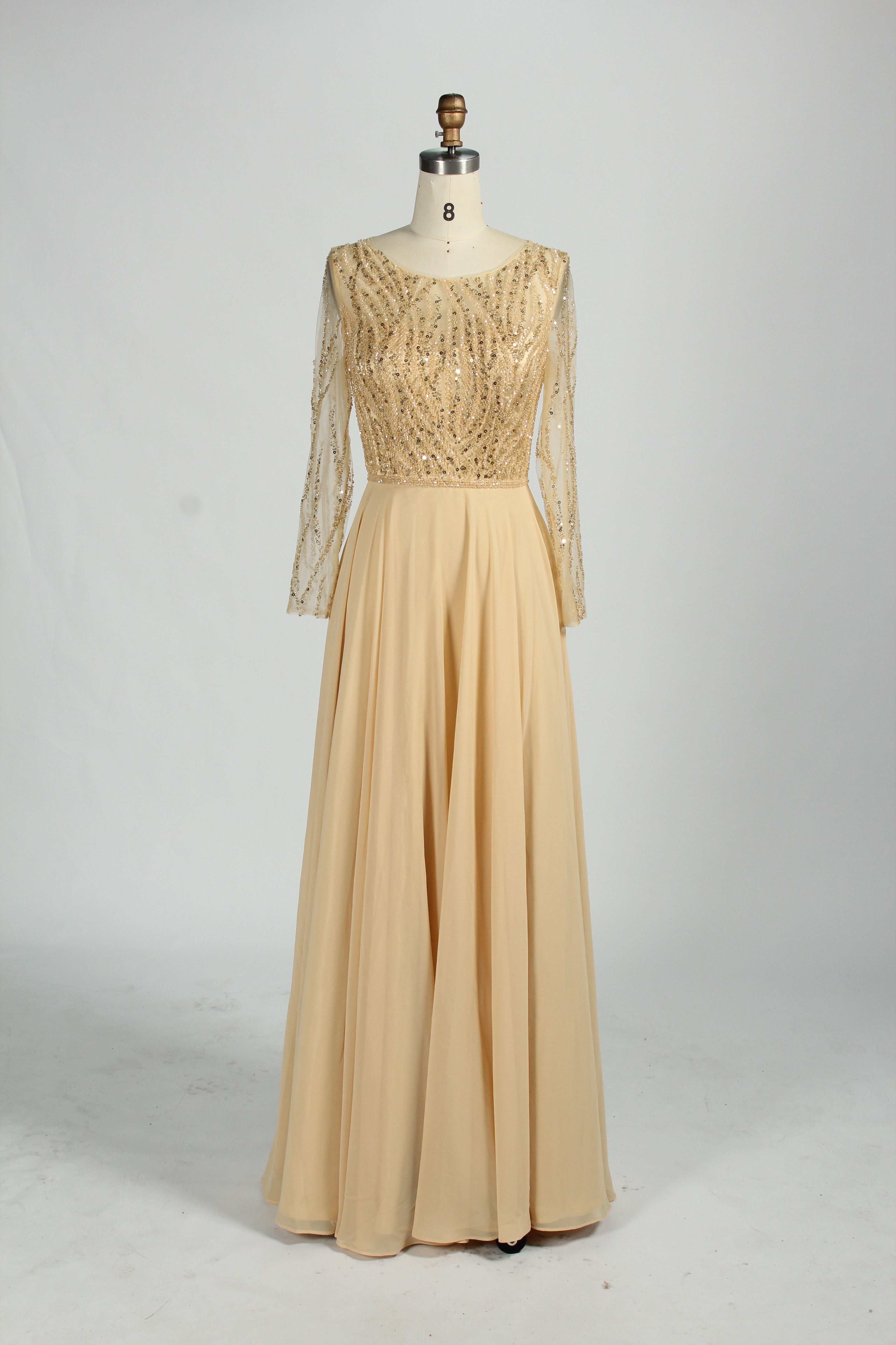 Champagne-gold mother-of-the-bride dress with long sheer sleeves and bead sequin bodice
