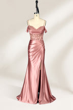 A mannequin displays a rose - gold satin gown. It has thin straps, off - shoulder lace - detailed sleeves, a ruched bodice, and a high side slit. The elegant design, blending satin and lace, suits formal events like galas or weddings.1