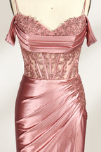 A mannequin displays a rose - gold satin gown. It has thin straps, off - shoulder lace - detailed sleeves, a ruched bodice, and a high side slit. The elegant design, blending satin and lace, suits formal events like galas or weddings.3