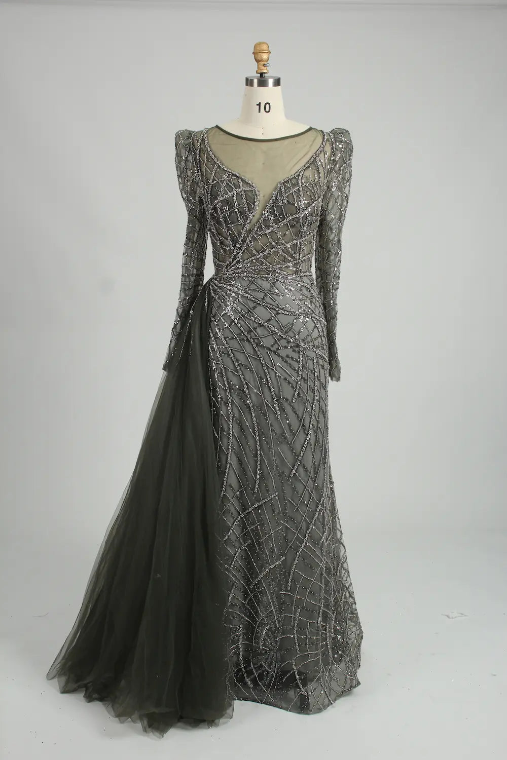 Dark charcoal long-sleeve mermaid gown with V-neckline, beaded lace, and side drape