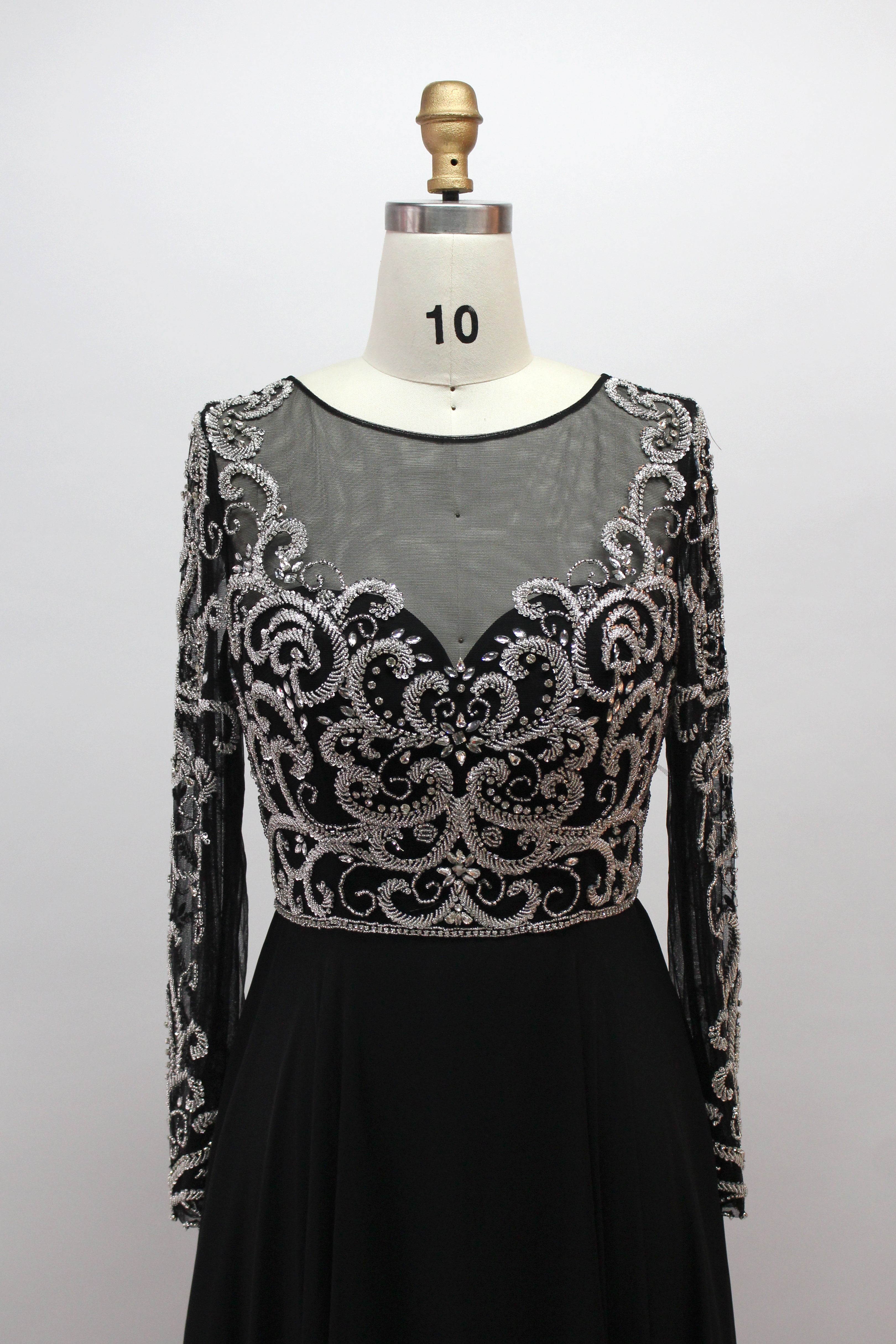 Black A-line evening dress with illusion high neckline and silver beaded embroidery