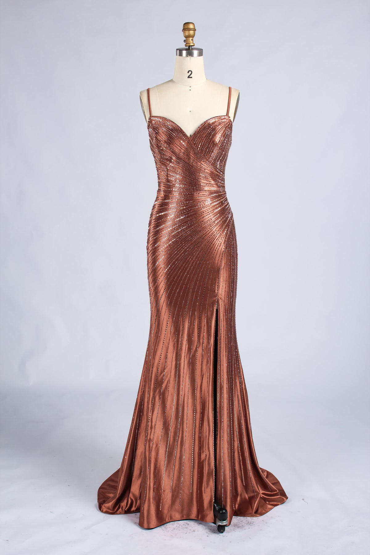 Brown beaded mermaid prom dress with spaghetti straps, sweetheart neckline, and floor-length flared skirt