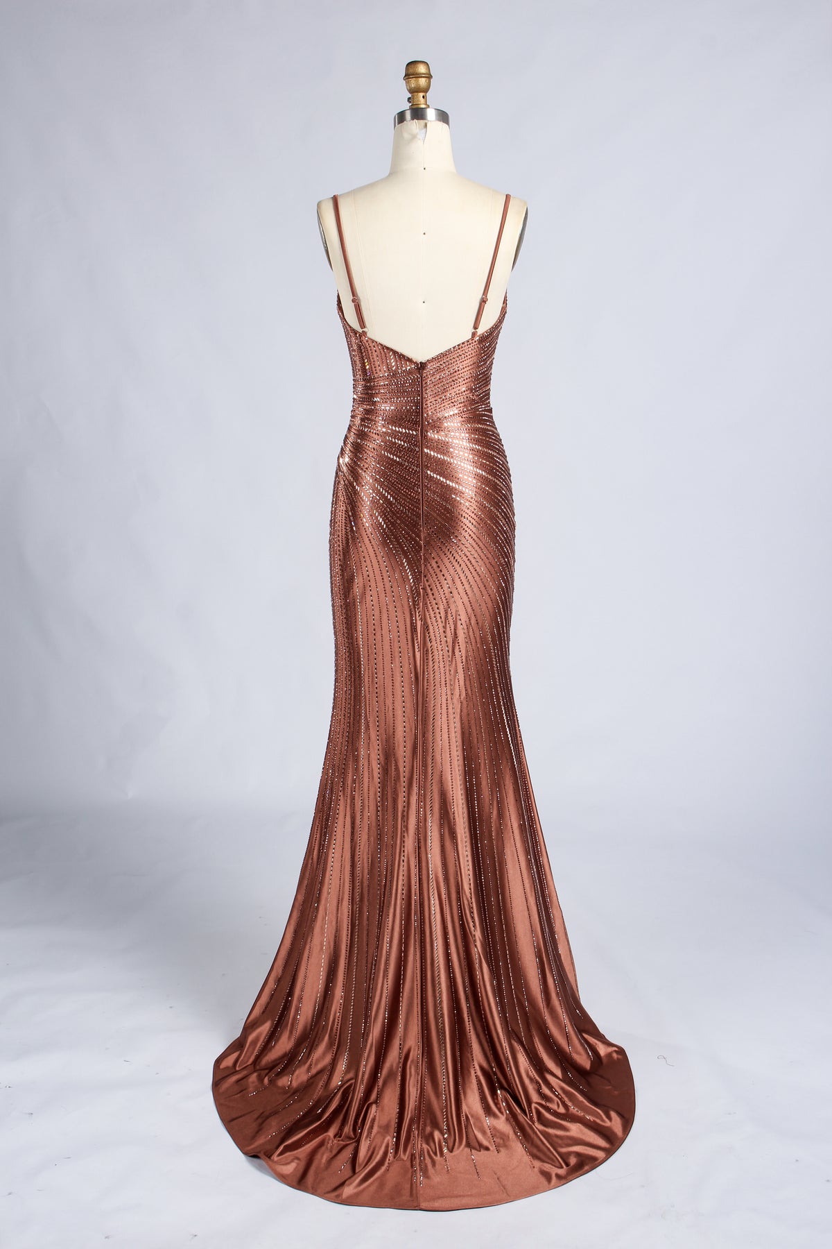 Back of the brown beaded mermaid prom dress, with thin straps and a floor-length flared skirt