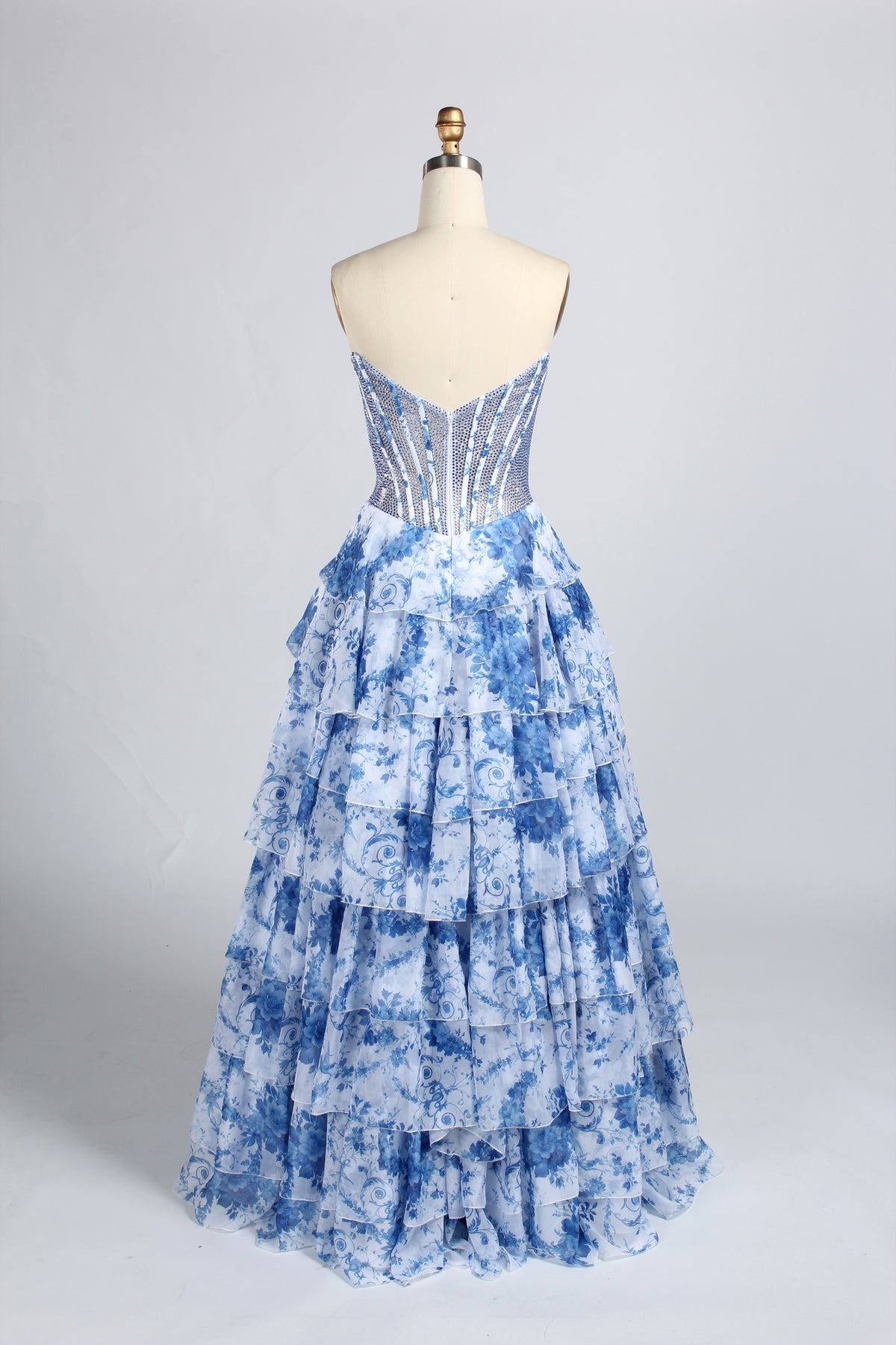 Blue floral strapless corset prom dress with tiered A-line skirt