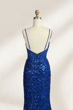 Set against a light background, a mannequin presents a blue gown adorned with sequins. It has thin straps, a deep V - neckline, and a mermaid - shaped skirt with a high side slit. The intricate sequin patterns and sheer bodice with embroidery add glamour, ideal for proms or formal dinners.4