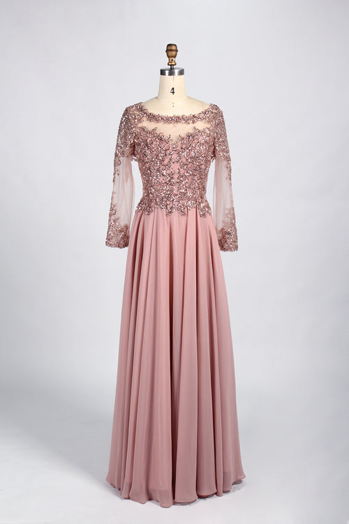 Blush pink sequined tulle gown with long sleeves and flowing pleated skirt