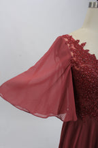 Burgundy beaded tulle V-neck dress with short sleeves and draped sleeve detail