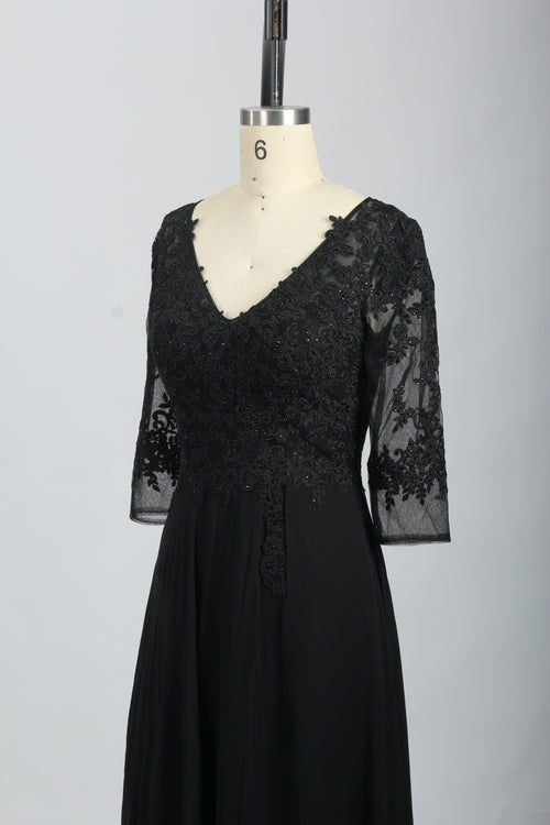 Black lace half-sleeve gown with V-neck bodice and sheer lace sleeves