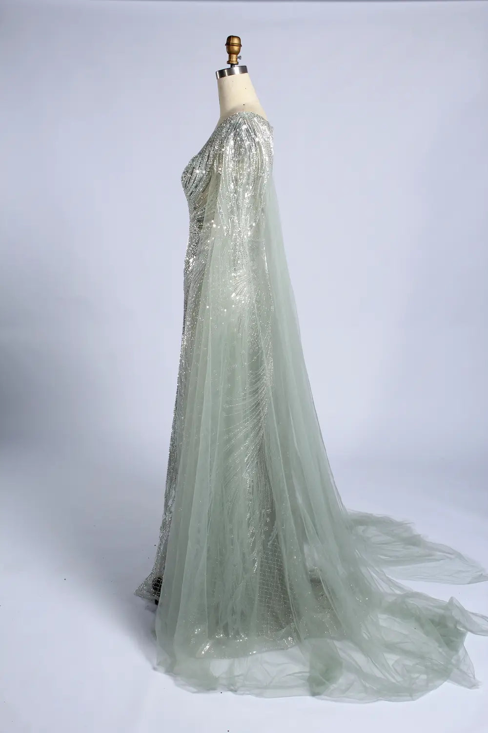 Silver sage beaded evening gown with flowing sheer cape sleeves and tulle skirt