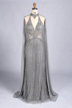Silver beaded halter mermaid gown with sheer cape overlay and V-neck sparkle