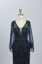Navy beaded V-neck mermaid dress with sheer sleeves, fitted waist, and geometric motifs