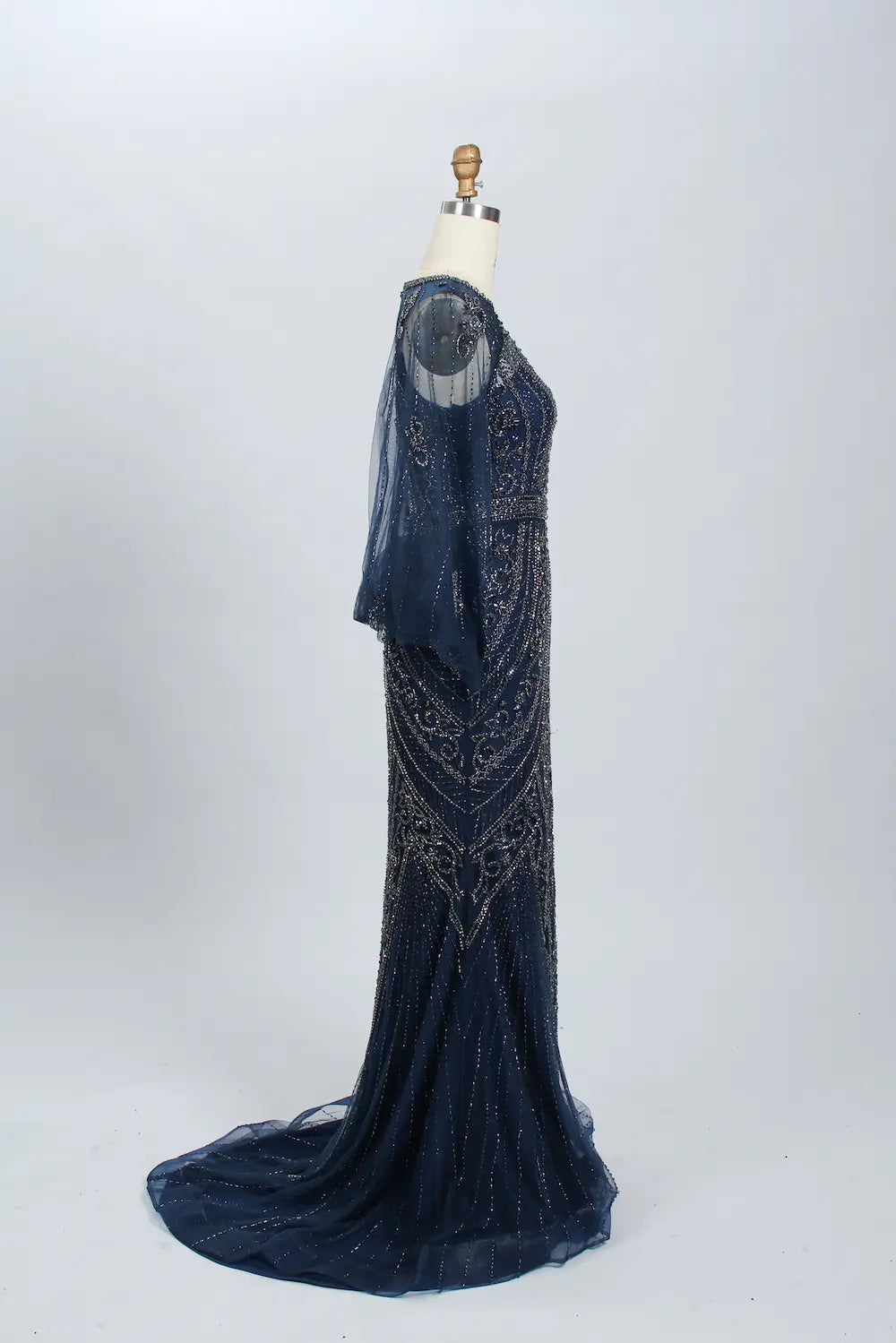Navy beaded mermaid gown with sheer long sleeves and V-back detail