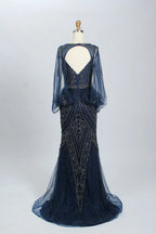 Navy beaded mermaid gown with sheer long sleeves and open-back V cut