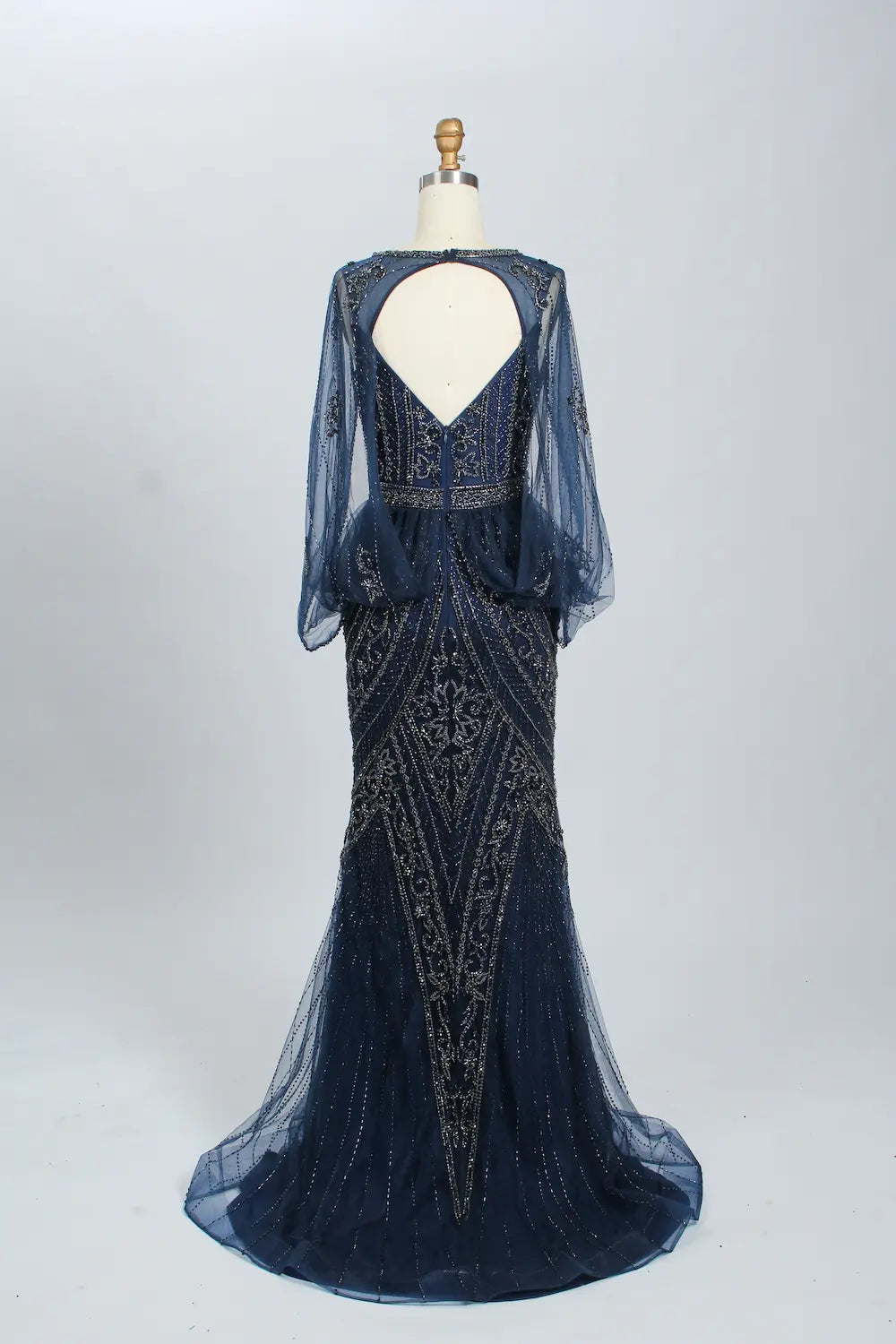 Navy beaded mermaid gown with sheer long sleeves and open-back V cut